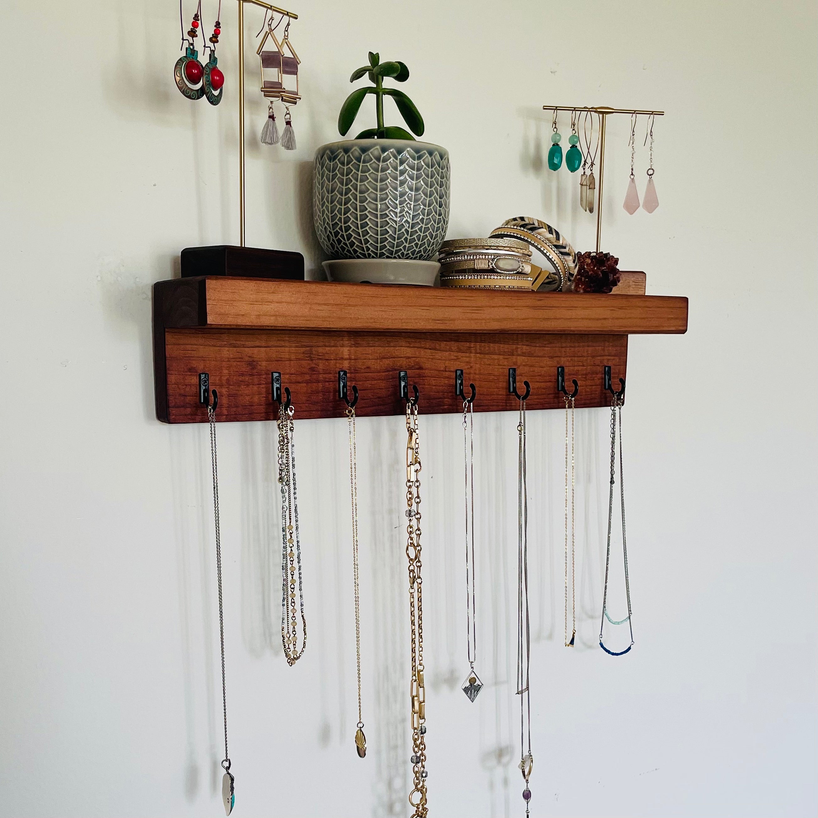 Jewelry Organization Ideas for 2026. Elegant Ways to Store and Display Your Collection 6 Decorative necklace display rack on bedroom wall